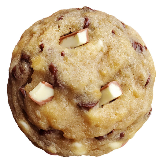 A cookie with pieces of a chopped kinder bar on top.