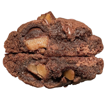Close-up of a chocolate cookie with toffee on a white background
