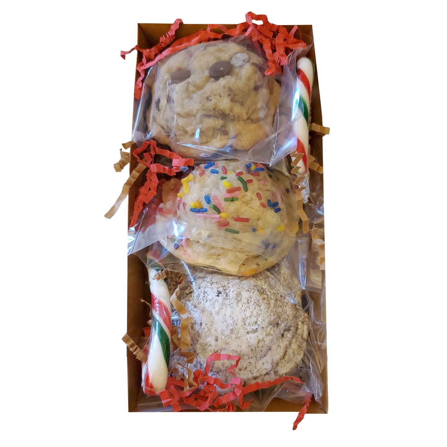 open box of 3 assorted cookies with 2 candy canes on a white background